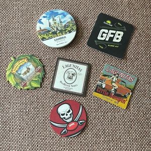 Lot of 21 paper coasters and 1 ceramic with cork backing